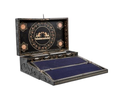 λ A SINHALESE CARVED EBONY PORTABLE WRITING CABINET WITH IVORY-INLAID LIONS Galle District, Southern Sri Lanka, 19th centuryO