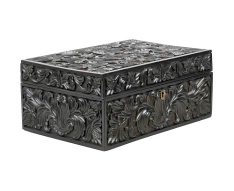 λ A SINHALESE CARVED EBONY LIDDED BOX WITH IVORY-INLAID FLOWER VASE DECORATION Galle District, Southern Sri Lanka, 19th centu
