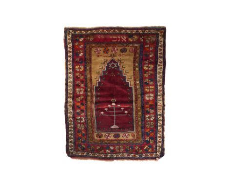 A RARE ANATOLIAN JEWISH PRAYER RUG WITH HEBREW INSCRIPTION Western or Central Anatolia, 19th centuryOf rectangular form, hand