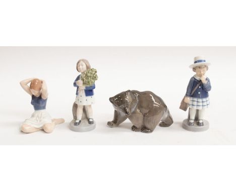 Royal Copenhagen: A grey bear, numbered 2841, two young ladies, no. 4527 and 4531, and a kneeling lady, no. 4648.Condition: A