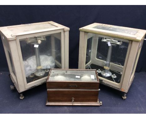 Two mid 20th Century glass and metal lab scales, along with wooden cased lab scales