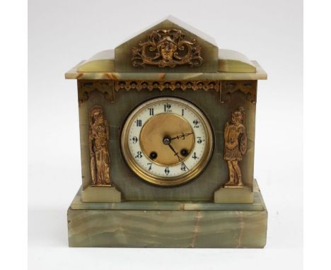 An onyx mantle clock with gilt detailing