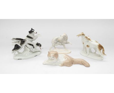 Royal Worcester and two German porcelain figures of hunting dogs, along with a Nao cat figure