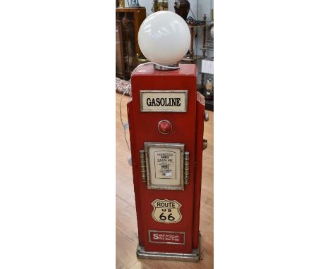 A late 20th century CD cabinet combined with a lamp in the style of an American Route 66 gasoline stand