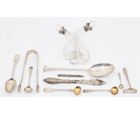 A collection of silver items to include; A Sterling silver Totem Pole brooch, a double spiral like designed oil bottle with B
