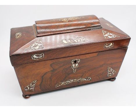 Sarcophagus-shaped Victorian rose mahogany tea caddy with mother-of-pearl detail and bun feet