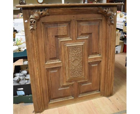 A large oak over-mantel panel with carved corner and central detail along with its mantel shelf, provenance Warter Priory, Yo