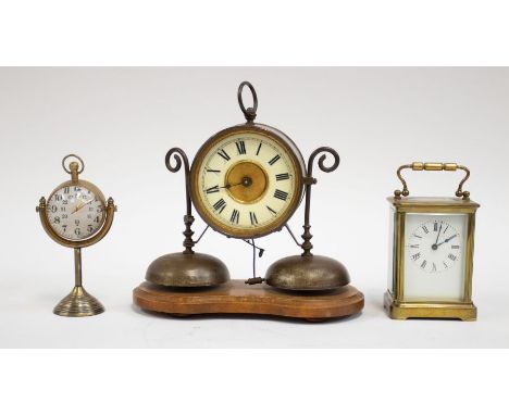 A presentation carriage clock with military related inscription, brass sphere shaped hanging clock and a ceramic dialled wood