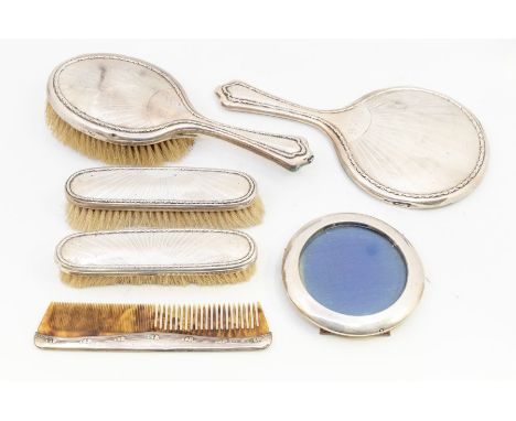 A collection of silver backed dressing table items to include; A matched dressing set of engine turned and knotted design Wal