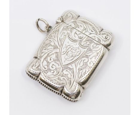 An Edwardian silver vesta case, profuse engraved floral decoration, central shield shaped cartouche with initials, on suspens