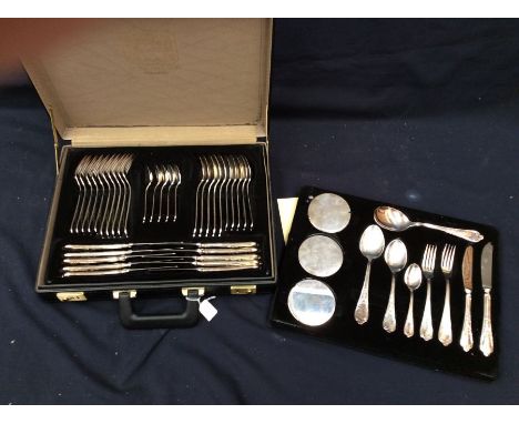 A Royal Solingen Collection silver plated flatware service within carry briefcase. To include serving, dessert and tea spoons