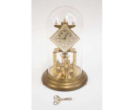 A mid 20th century anniversary Kundo mantel clock in a dome