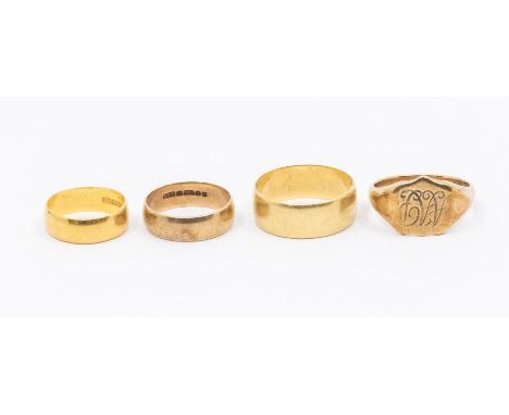 A collection of four gold rings, to include a 22ct gold band, width approx 5mm, size K, weight approx 4gms along with a 18ct 