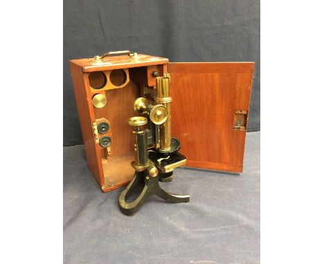 A late 19th century mahogany-cased tabletop microscope by J. Swift and Sons, 81 Tottenham Court Road, London, with accessorie