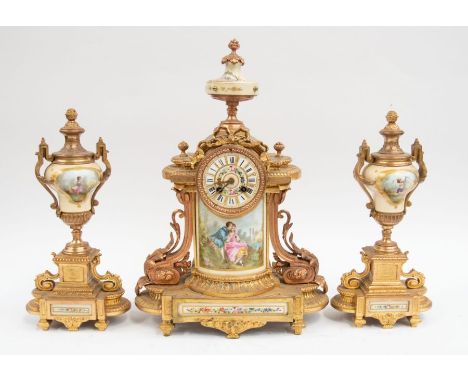 A late 19th century gilt spelter French mantel clock with garnitures