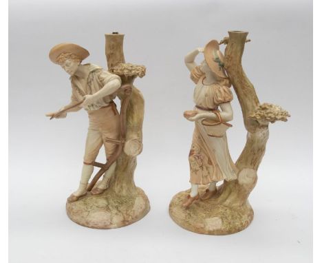 A pair of Hadley Royal Worcester figural lamps.Condition: professional restoration. Total height: 13"
