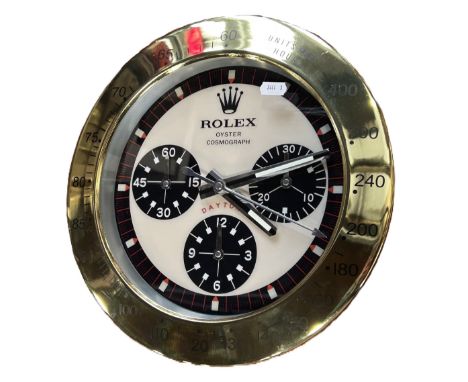 A contemporary decorative ‘Rolex dealer display’ wall clock, marked ‘Rolex, Oyster Cosmograph Daytona’ to the 10” dial.