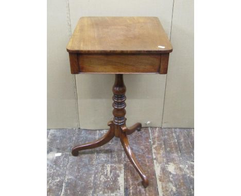 A Regency mahogany side or lamp table of rectangular form enclosing a frieze drawer, raised on turned pillar and tripod base,