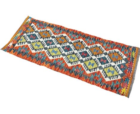 A Chobi Kilim runner with a central panel of stepped diamonds, 149cm x 59cm