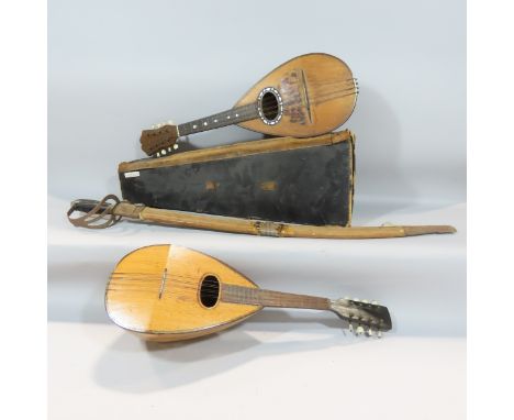 A cased Mandolin bearing a label Arturo Farini to the inside with a case, together with another mandolin and an old Indian sw