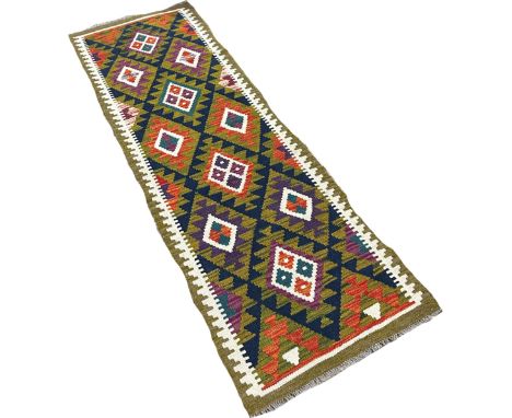 A Maimama kilim runner with alternating rows of diamonds on a dark field, 202cm x 63cm approximately