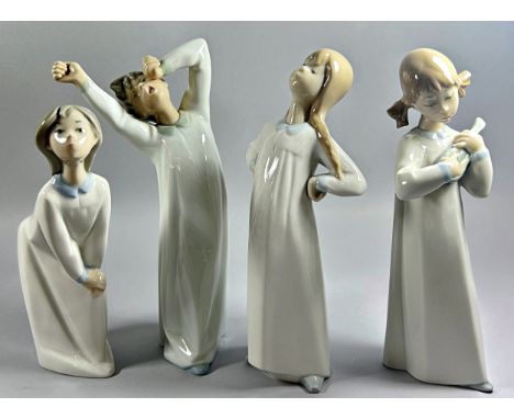 A collection of Lladro figure groups of children in their nightgowns in various poses to include a boy and girl praying, litt