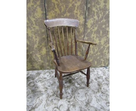 A late 19th century Windsor elm and beechwood stick back open armchair 