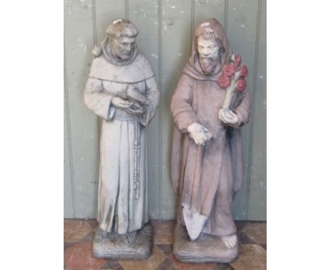 Two weathered (one painted) cast composition stone garden ornaments in the form of monks, 75 cm high