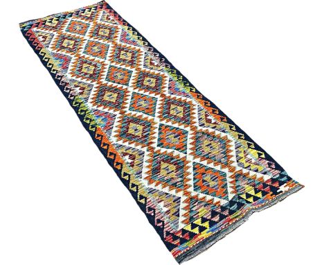 A Chobi Kilim runner with alternating rows of multicoloured diamonds 248cm x 81cm Approximately 