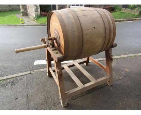 An unusually large vintage Hathaway coopered oak and steel banded two handled butter churn and pine stand, (af) lacks lid/doo