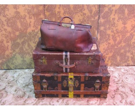 A leather Gladstone bag with brass fittings, an antique steamer trunk timber lathe and steel bound, and a vintage Harrods sui