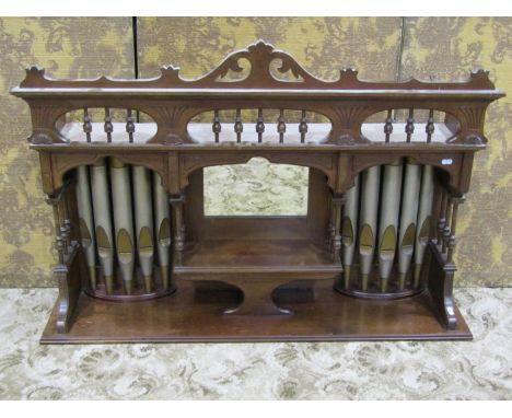 An Edwardian walnut over mantel (probably removed from a harmonium), with decorative outline, central mirror panel flanked by