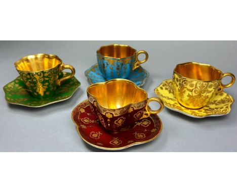 Four Coalport cabinet cups and saucers in individual colourways with gilt lined interiors 