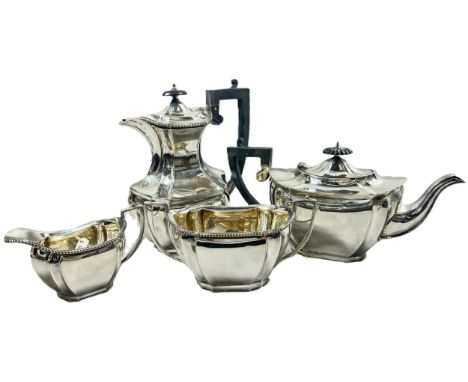 An extensive collection of silver plate to include tea service, wine coasters, napkin rings, cutlery, ice buckets, flatware e