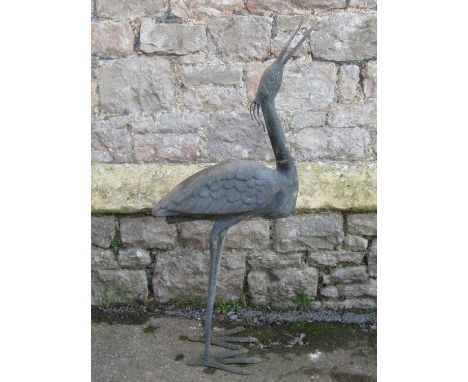 A contemporary weathered cast bronze garden ornament in the form of a stork,  95 cm high