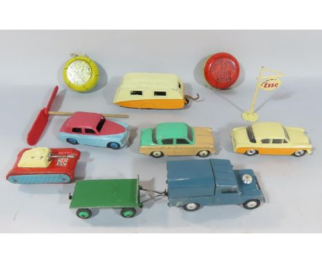 A collection of play worn Dinky and Corgi die cast vehicles, a tin tank, two yo- yos, an Esso petrol pump sign.
