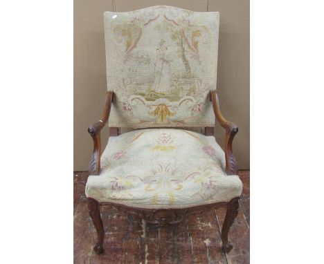 A 19th century walnut open armchair with acanthus carved detail, with original tapestry panelled seat and back