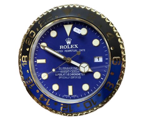 A contemporary decorative ‘Rolex dealer display’ wall clock, marked ‘Rolex, Oyster Perpetual Date, Submariner’ to the blue 10