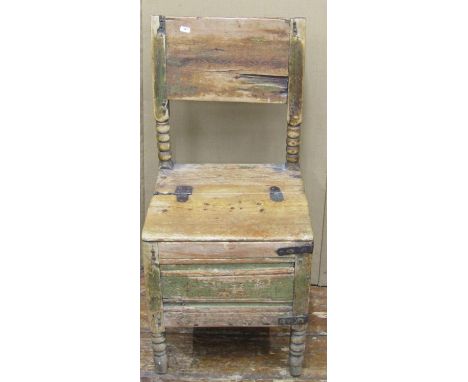 A rustic pine box chair, with bobbin supports, steel banded repairs and traces of original paint