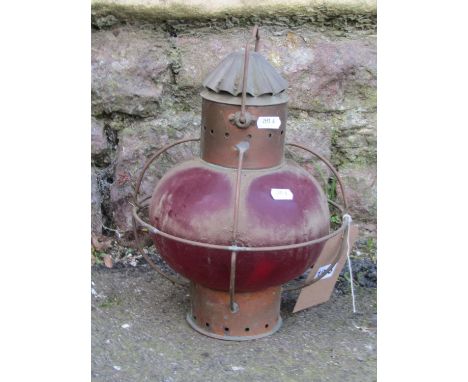 A vintage copper marine lamp with encased ruby glass shade, 34 cm high, together with a small vintage public notice, 24 cm x 