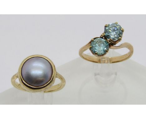 Arts &amp; Crafts yellow metal blister pearl ring, size M, 4.2g and a further yellow metal blue topaz crossover ring, indisti