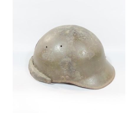 A French WWI period trench helmet with applied "R F" (Republique Francaise) insignia