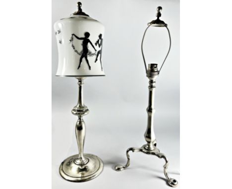 A baluster shaped table lamp with a glass shade decorated with Pan chasing Nymphs, together with another lamp similar on a tr