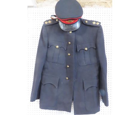 Three British Army uniforms, two khaki and one Royal Artillery Ceremonial blue uniform with red striped trousers and cap.