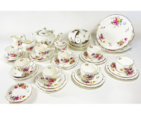 A Royal Crown Derby floral pattern tea service for twelve with additional jam pot and cover, sandwich plates etc
