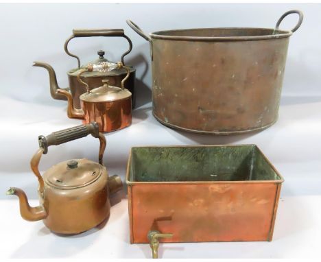 A 19th century copper cistern, three copper kettles, a large saucepan together with a cast iron set of scales and a old Yoke