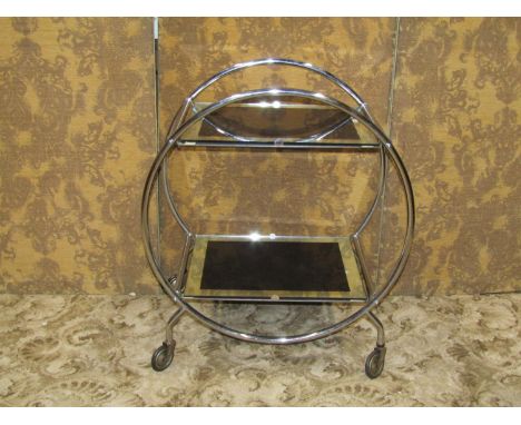 An Art Deco style tea trolley, the open tubular ring frame supporting two graduated mirror glass panels