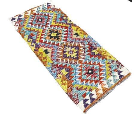 A Chobi kilim runner with a repeating all over diamond pattern, 142cm x 63cm
