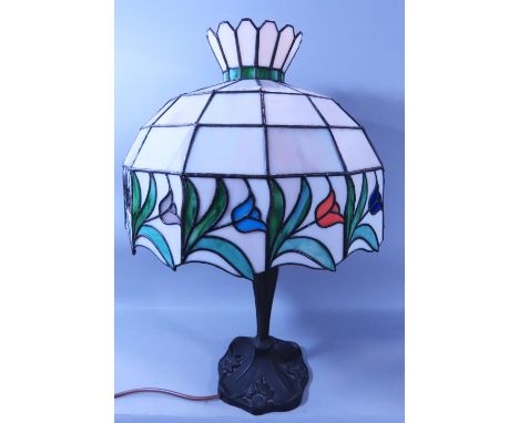A reproduction Liberty style Art Nouveau style table lamp with a tulip decorated “leaded” shade, together with a crackle glaz