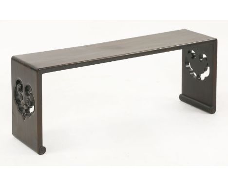 A hongmu low Bench,late 19th century, the pierced ends with ruyi, on scroll feet,84cm wide22cm deep34cm high清十九世纪末 红木镂雕如意纹长凳